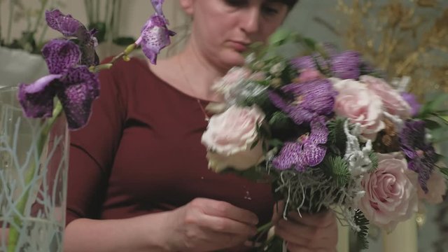 The work of the florist. Creating a flower bouquet