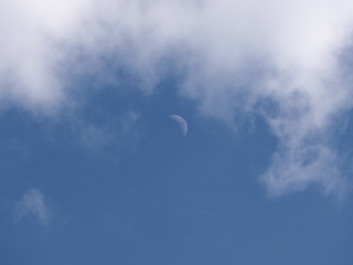 Clouds, sky and the moon.
