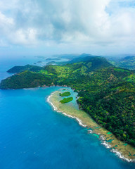 Wide aerial shot of Panama coastline landscape with island, coral and clear sea with turquoise water. Drone photo. Top view.