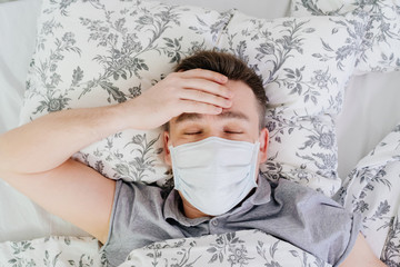 close eyes the masked man lies at home in bed 
