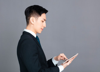  young business man using the digital tablet