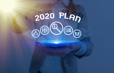 Conceptual hand writing showing 2020 Plan. Concept meaning setting up your goals and plans for the...
