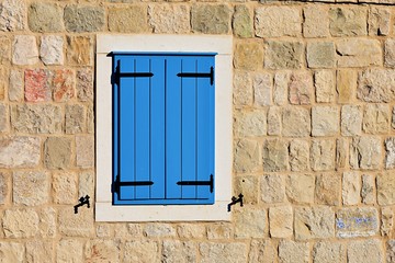 Fototapeta na wymiar old window on blue wall