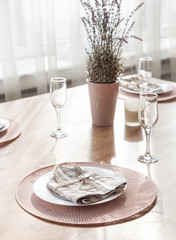  Empty plate and silverware set on wooden table