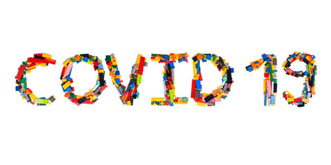 Inscription  COVID-19 of the English alphabet  from multi-colored children's plastic constructor on a white isolated background.Child and medical  pattern.Sign  from a photo of kids design