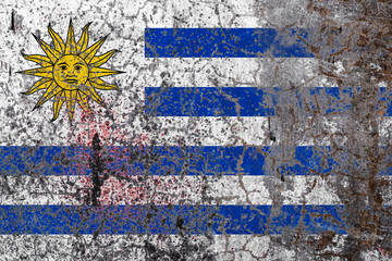 National flag on old peeling wall background.