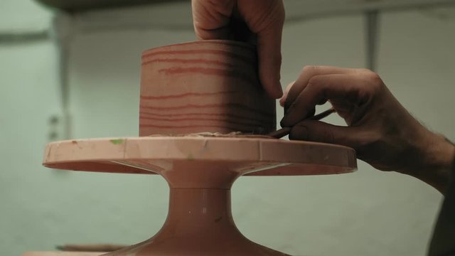 Ceramist work in the workshop.