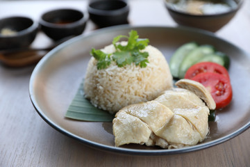 Thai food gourmet steamed chicken with rice , khao mun kai in wood background