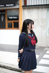 Portrait japanese school girl in downtown ice cream shop