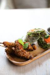 Chicken Satay on wood background