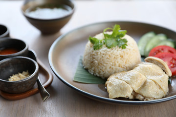 Thai food gourmet steamed chicken with rice , khao mun kai in wood background