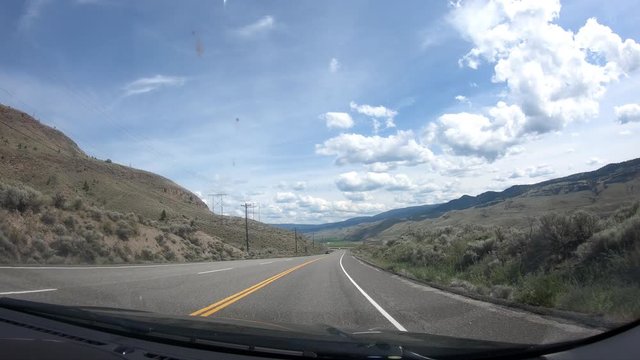 Timelaps of dashcam from a car travleing along Duffey Lake Road in desert enviroment