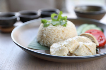 Thai food gourmet steamed chicken with rice , khao mun kai in wood background