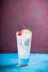 Rum collins cocktail (variation of traditional Tom collins). Selective focus. Shallow depth of field.