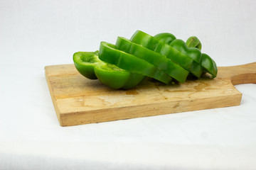 chopped peppers on a board