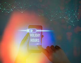 Writing note showing Holiday Hours. Business concept for employee receives twice their normal pay...