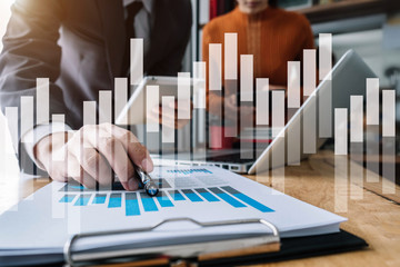 Business team New Professional Investor Starts Project Meet with Financial Manager, Designing a Computer, Tablet, Digital Phone, Smartphone at office in the Morning.
