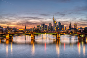 The skyline of Frankfurt in Germany and the Main river after sunset