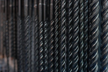 Dark background with assorted drill parts - close up photo with selective focus