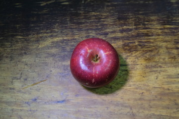 red apple on a dark wooden background