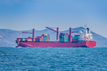 Fototapeta premium The Container ship business import export logistic and transportation by container ship with blue sky background.