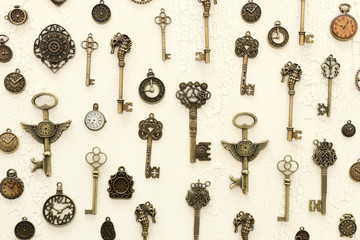 Fototapeta na wymiar Image of old antique keys and clocks over wooden background. Top view, flat lay