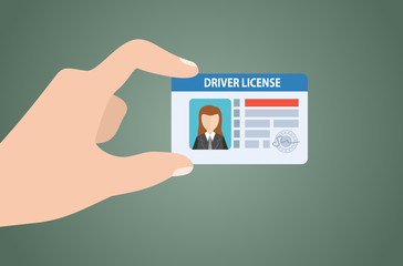 Hand is hold Driver License. Important documents to show to the highway officers for driving.