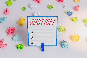 Conceptual hand writing showing Justice. Concept meaning impartial adjustment of conflicting claims or assignments Colored crumpled paper empty reminder white floor clothespin