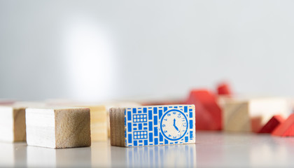 Wooden toy blocks to assemble with architectural and construction motifs on white background