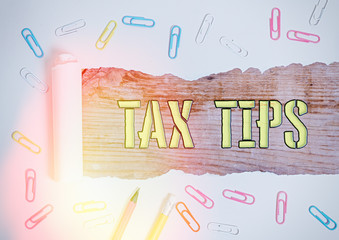 Word writing text Tax Tips. Business photo showcasing compulsory contribution to state revenue...