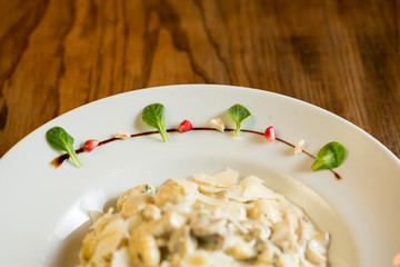 Gnocchi with turkey meat and porcini mushrooms in a cream sauce