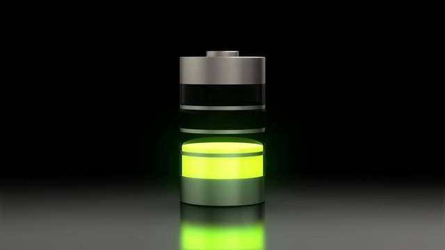 Electronic device battery discharge process. Rechargeable battery standing on gray floor against black background. Battery power changing from green through yellow to red while its capacity decreasing