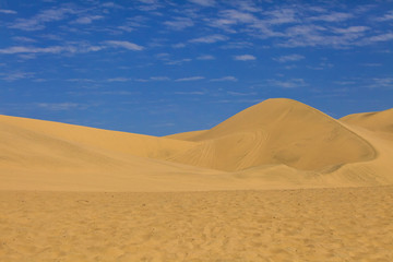 Fototapeta na wymiar Sand dunes in the Atacama desert in Peru