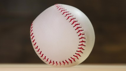 Baseball rotating on the black background. Close up.