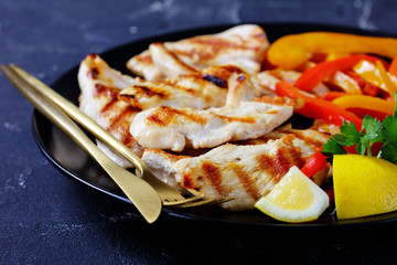 Homemade grilled chicken breast strips with pepper