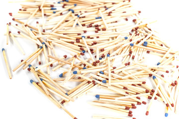pile of matched sticks on white background