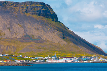 Icelandic village near mountain base 