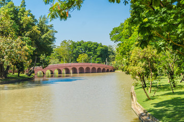 Scenic view of the park. The  bow bridge in park at spring sunny day