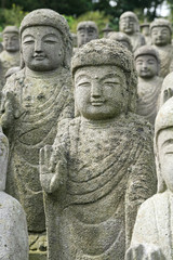 Buddha statues standing in line