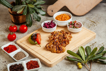 fried chicken served with salad and grilled vegetables