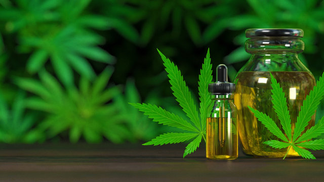 Marijuana and cannabis oil bottles on a green background (computer-generated image)