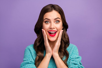 Closeup photo of beautiful pretty curly lady red lips good mood listen amazing news open mouth arms on cheeks wear blue knitted pullover isolated purple color background
