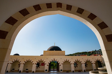 the arcade through which you can see the inner courtyard of a Muslim mosque