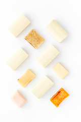 Soap bars flat lay on white background top-down pattern