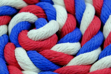 Fototapeta na wymiar Colored bright rope twisted in a spiral for background