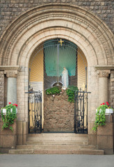 Main entrance to christian roman catholic church of our Lady of Lourdes in St. Petersburg, Russia