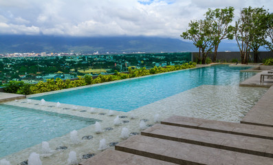 Swimming pool on condo and city view.