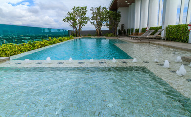 Swimming pool on condo and city view.