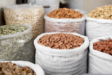 Close-up of assorted nuts in plastic bags. Healthy food for vegetarians.