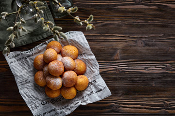 Rosy cheese balls on a dark wooden background. Top view.